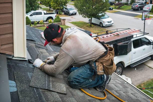 Professional Roofing technician working in Central City, IA